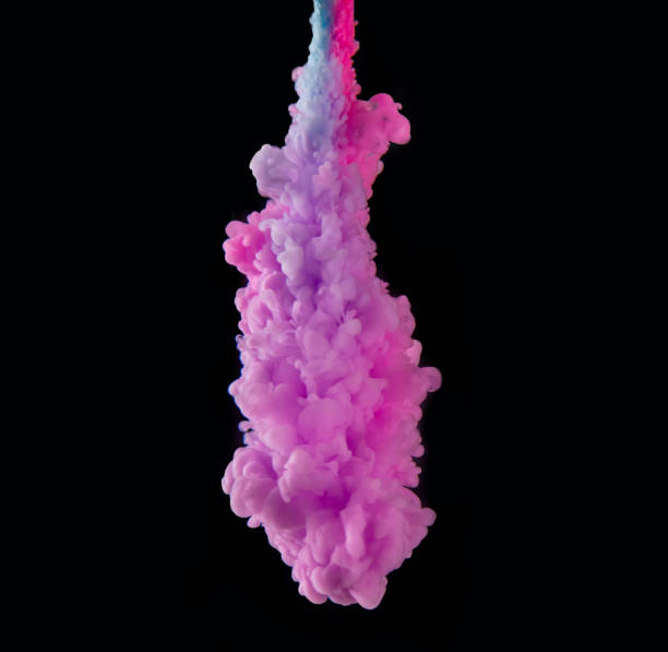 istock Coloured acrylic ink mixing in water on black 1138183280