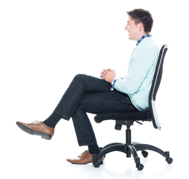 istock Handsome young man sitting and and being happy, side view 1138184420