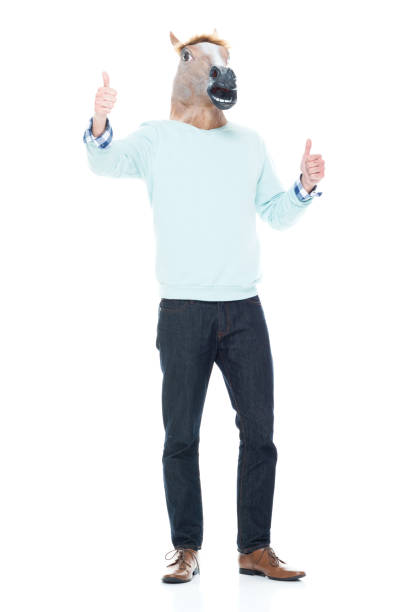istock Man with horse mask showing thumbs up 1138184602