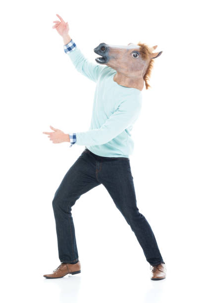 istock Man with horse mask is being silly 1138184610