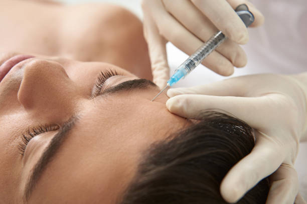 istock Man on beauty care procedure of crows feet 1138186473