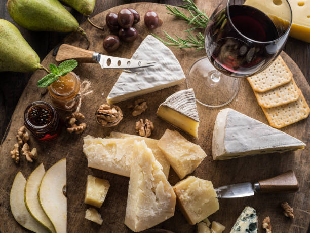 istock Cheese platter with organic cheeses, fruits, nuts and wine. 1138188048
