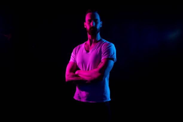 istock Handsome man in white tshirt with gel lighting 1138189446