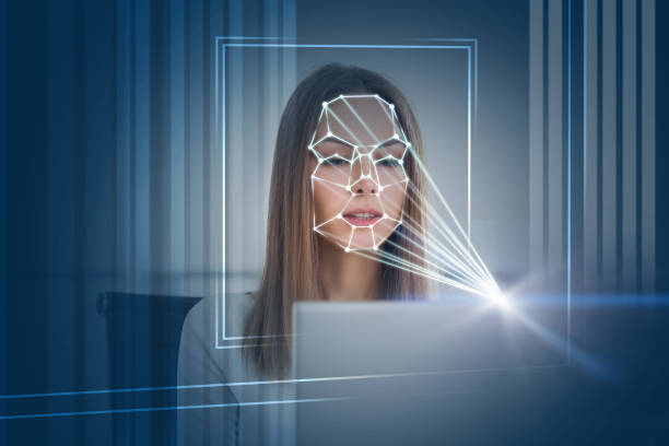 istock Woman with laptop face recognition technology 1138190347