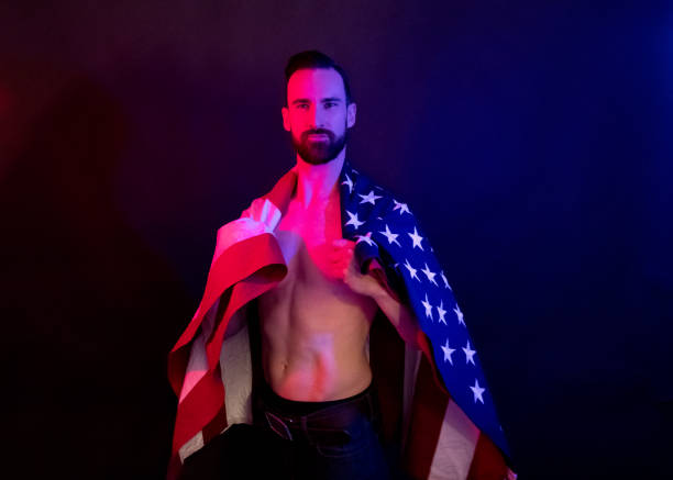 istock Handsome man holding an American flag 1138191451