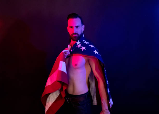 istock Handsome man holding an American flag 1138191546
