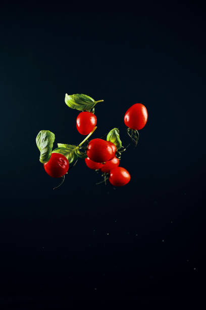 istock Food Explosion with Cherry Tomatoes and Basil 1138192832
