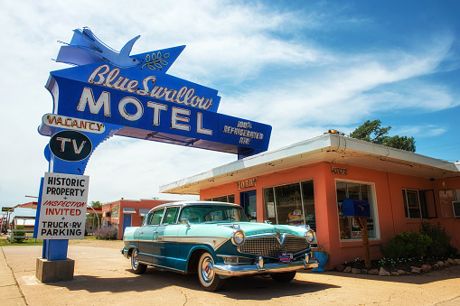 Tucumcari, New Mexico, USA - 04.07.2015: Blue Swallow Motel with vintage car. This famous hotel is listed on the National Register of Historic Places in New Mexico. It is located on route 66.