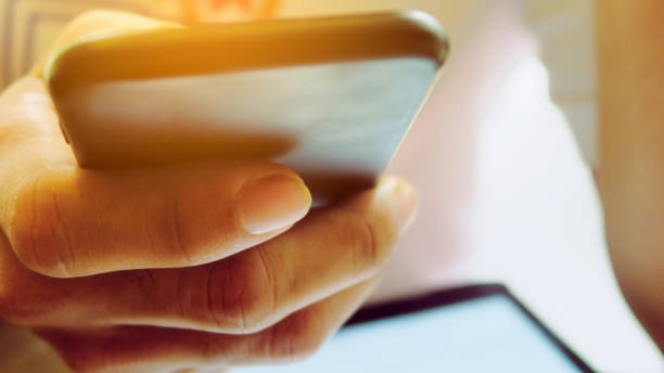 istock Closeup Image of man's hand holding a smartphone 1138193034