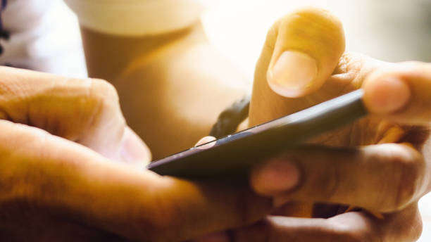 istock Closeup Image of man's hand holding a smartphone 1138193063
