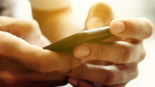istock Closeup Image of man's hand holding a smartphone 1138193090