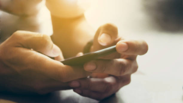istock Closeup Image of man's hand holding a smartphone 1138193099