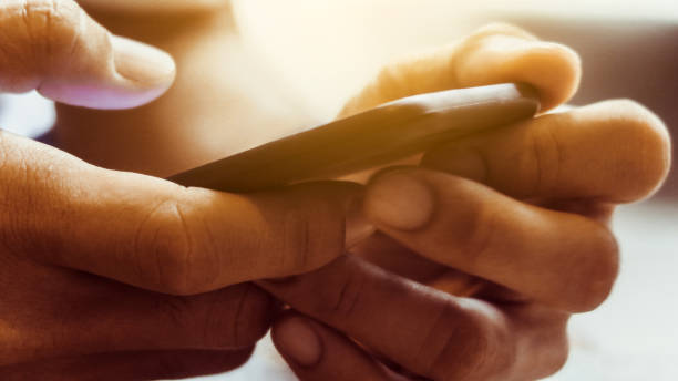 istock Closeup Image of man's hand holding a smartphone 1138193116