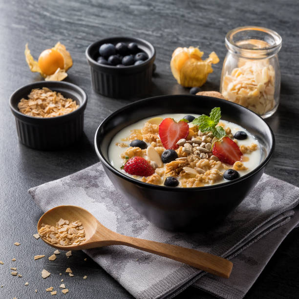 istock Healthy breakfast. yogurt with fresh berries and cereal on marble. Top view. 1138194337