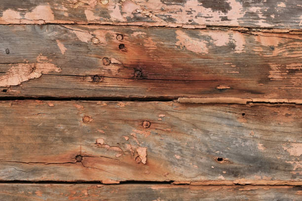 istock Weathered wooden planks shipboard background with rust, nails and peeling paint - old shipwreck 1138195907
