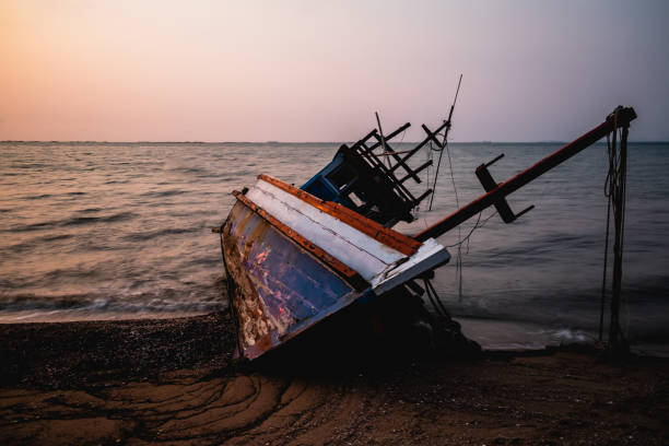istock Fishing boats stranded on the beach 1138197215