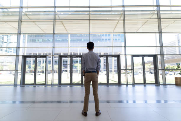 istock asian male executive standing in modern office 1138197310