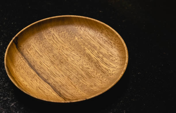 istock Wooden dish on the black table 1138197456