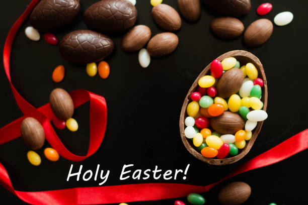 istock Big and small chocolate Easter eggs decorated with red ribbon 1138198238