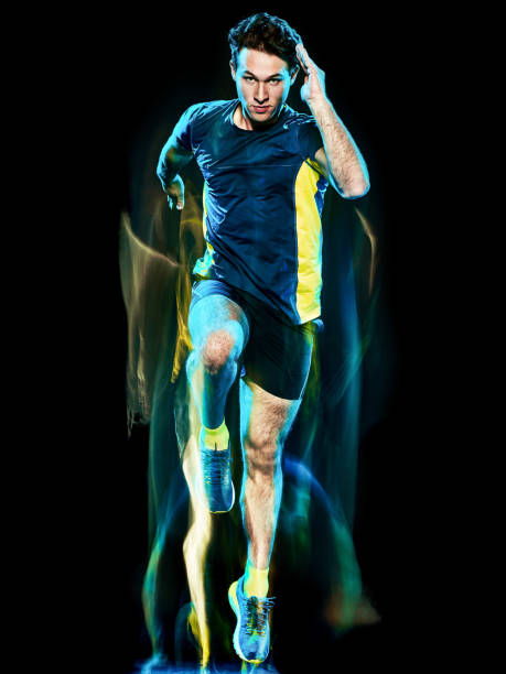 istock runner running jogger jogging man isolated light painting black background 1138199379