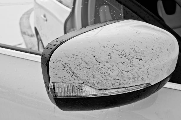 Dirty white car mirror from a Land Rover.
