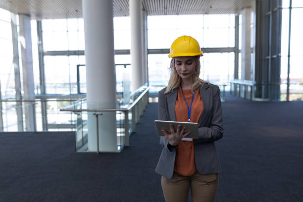 istock Blonde Caucasian female architect using digital tablet in office 1138201882