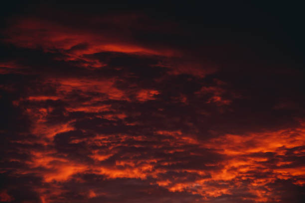 istock Fiery red blood vampire dawn. Amazing warm dramatic fire cloudy sky. Vivid orange sunlight. Atmospheric background of sunrise in overcast weather. Hard cloudiness. Storm clouds warning. Copy space. 1138202097