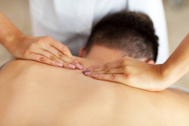 istock Handsome man having massage in spa salon 1138203028