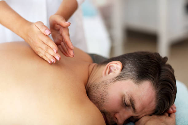 istock Handsome man having massage in spa salon 1138203036