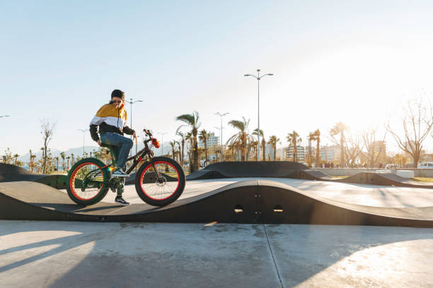 Adult male on BMX bike in midair.