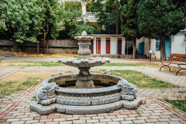 Photo of Abandoned old round fountain in old park