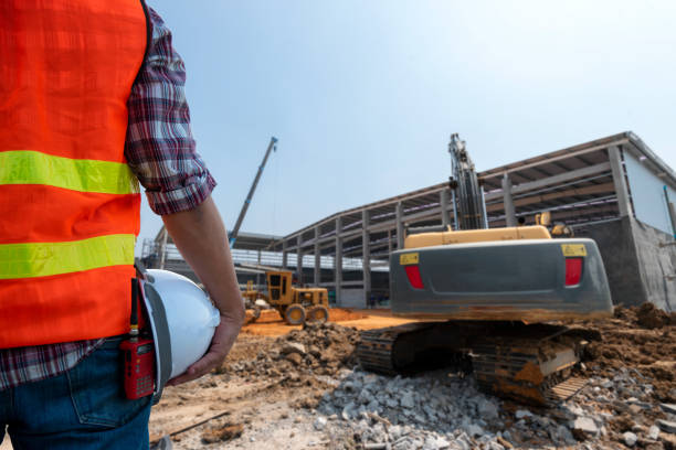 construction worker with construction site background. - social housing audio imagens e fotografias de stock