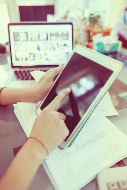 istock Business girl holding and touching on tablet during working 1138206365