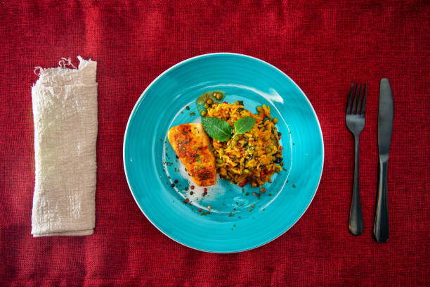 istock Andalusian fish, saffron rice with vegetables 1138208432