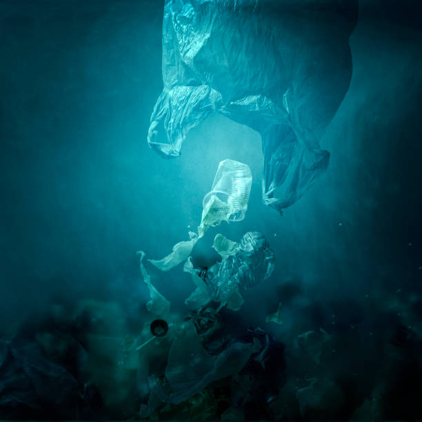 istock Floating plastic bag dispersing waste and polluting the ocean 1138212504