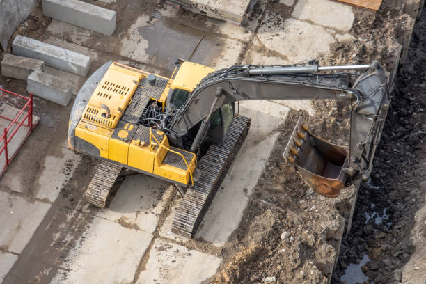 istock Excavator on at a construction site, ditch, reconstruction of communication along roads and pavements. 1138213098