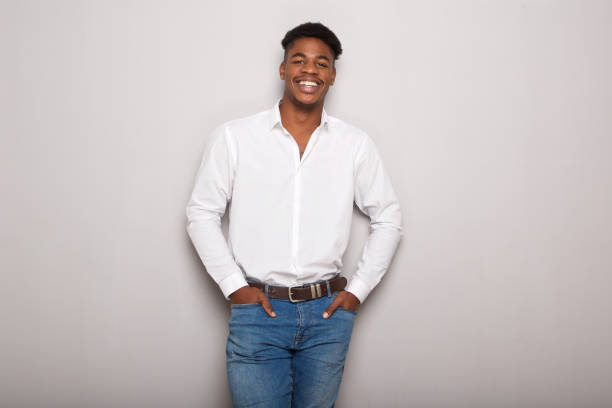 istock handsome young black man against gray background 1138213109