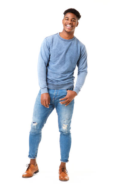 istock Full body smiling young black man standing against isolated white background 1138213212