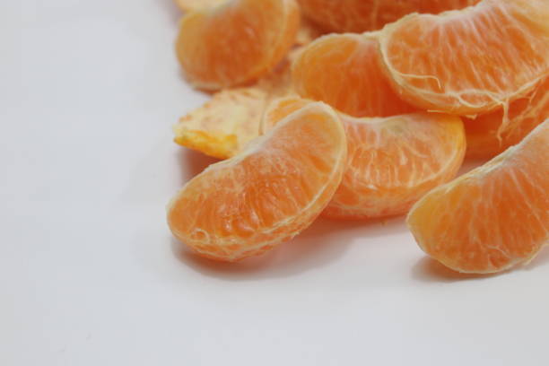 istock Peeled Orange on White Background 1138214730