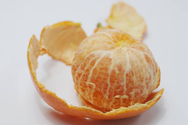 istock Peeled Orange on White Background 1138214807