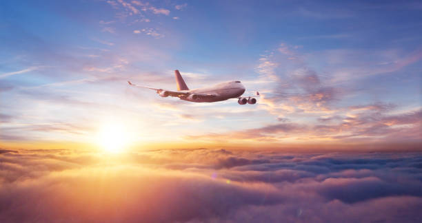 istock Commercial airplane flying over dramatic sunset 1138215067