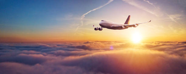 istock Commercial airplane flying over dramatic sunset 1138215071