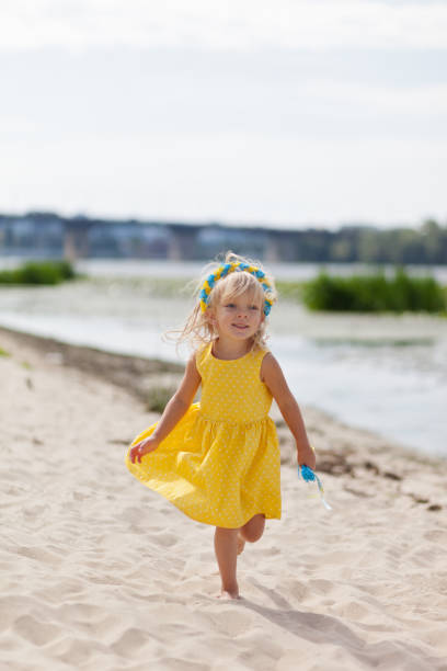 istock Little girl on the beach 1138215745