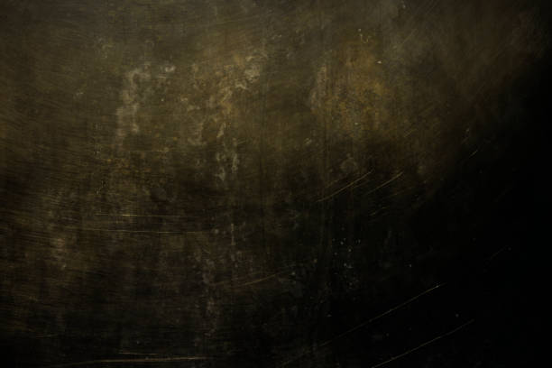 istock dark grungy golden wall background or texture 1138216226