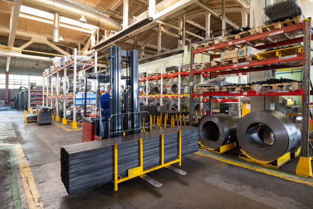 istock Factory stock wire. Wire spools lie on multi-tiered racks. 1138216376