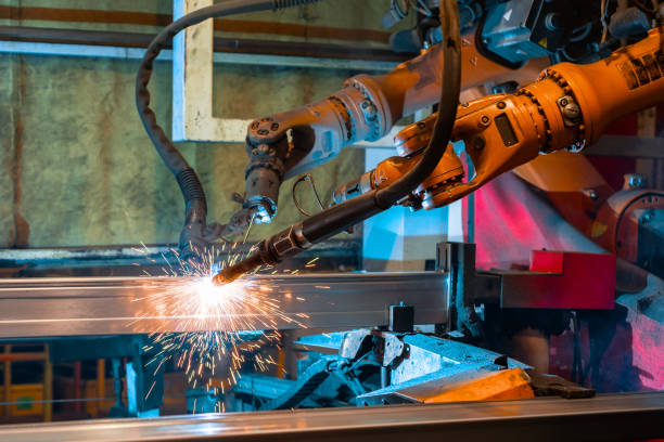 istock Welding robot, the process of welding a metal profile. 1138216393