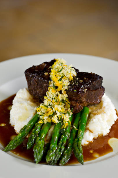 istock Filet on a bed of asparagus and mashed potatoes with gravy 1138216724