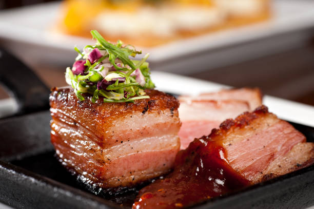 Grilled pork belly with coleslaw and spicy bbq sauce
