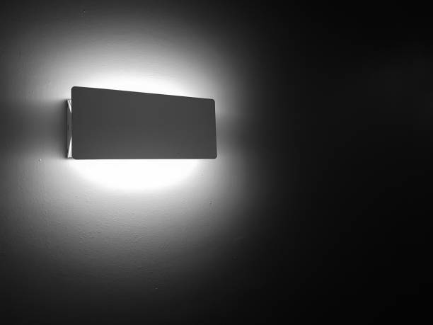 istock Wall lamp glowing brightly in the darkness 1138217595