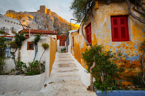 Traditional greek house with colorful blue door and pink walls at Asos village. Assos peninsula famous and extremely popular travel destination in Cephalonia, Greece, Europe